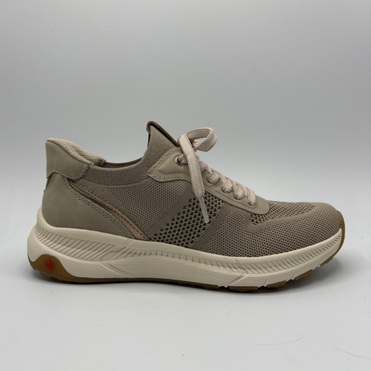 Beige sneaker on a gray background