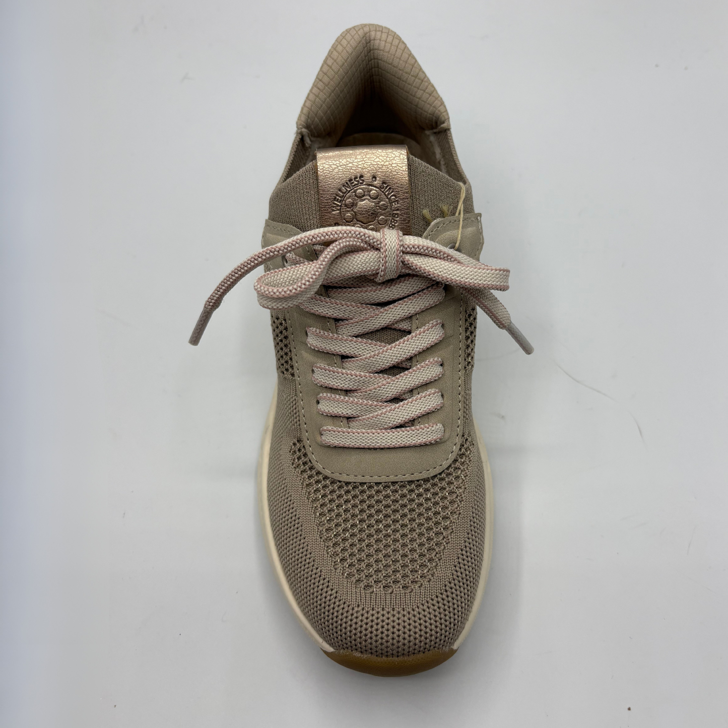 Beige sneaker with laces on a light gray background