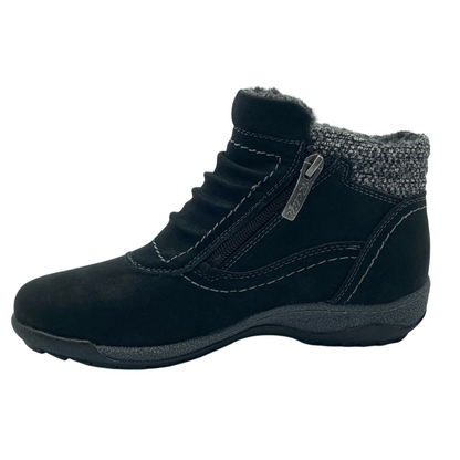 Left facing view of black suede ankle bootie with rubber outsole and grey insulated lining, side zipper and rounded toe