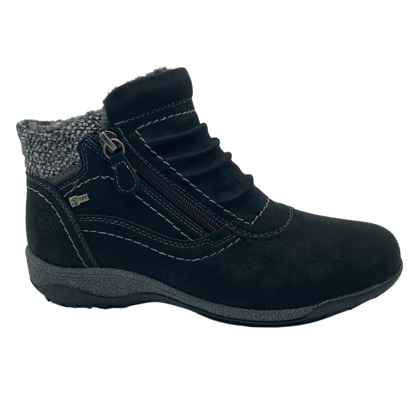 Right facing view of black suede ankle boot with rubber outsole and side zipper closure. Grey insulated lining and slouched detail on upper