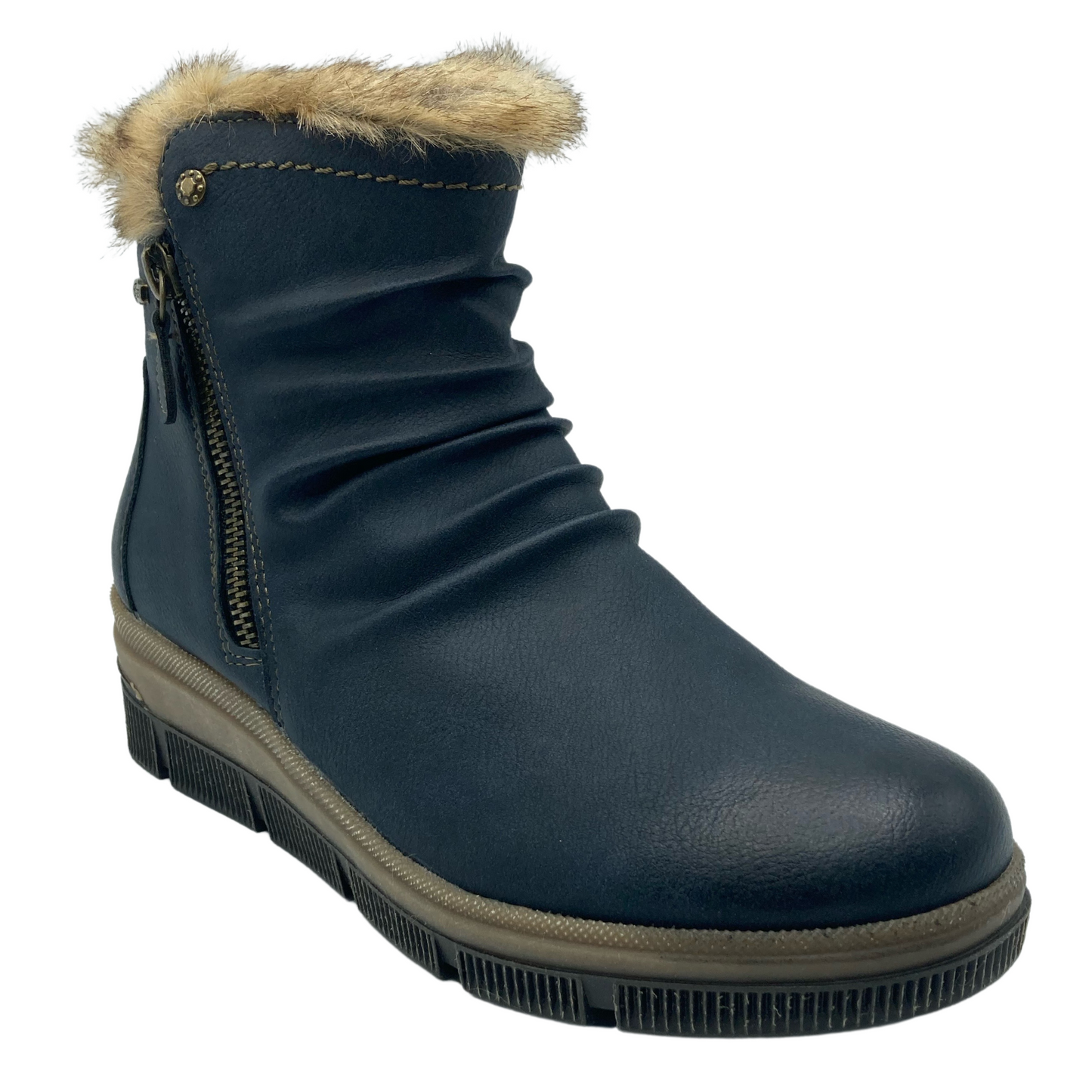 45 degree angled view of blue, vegan leather bootie with brown faux fur lining and rubber outsole