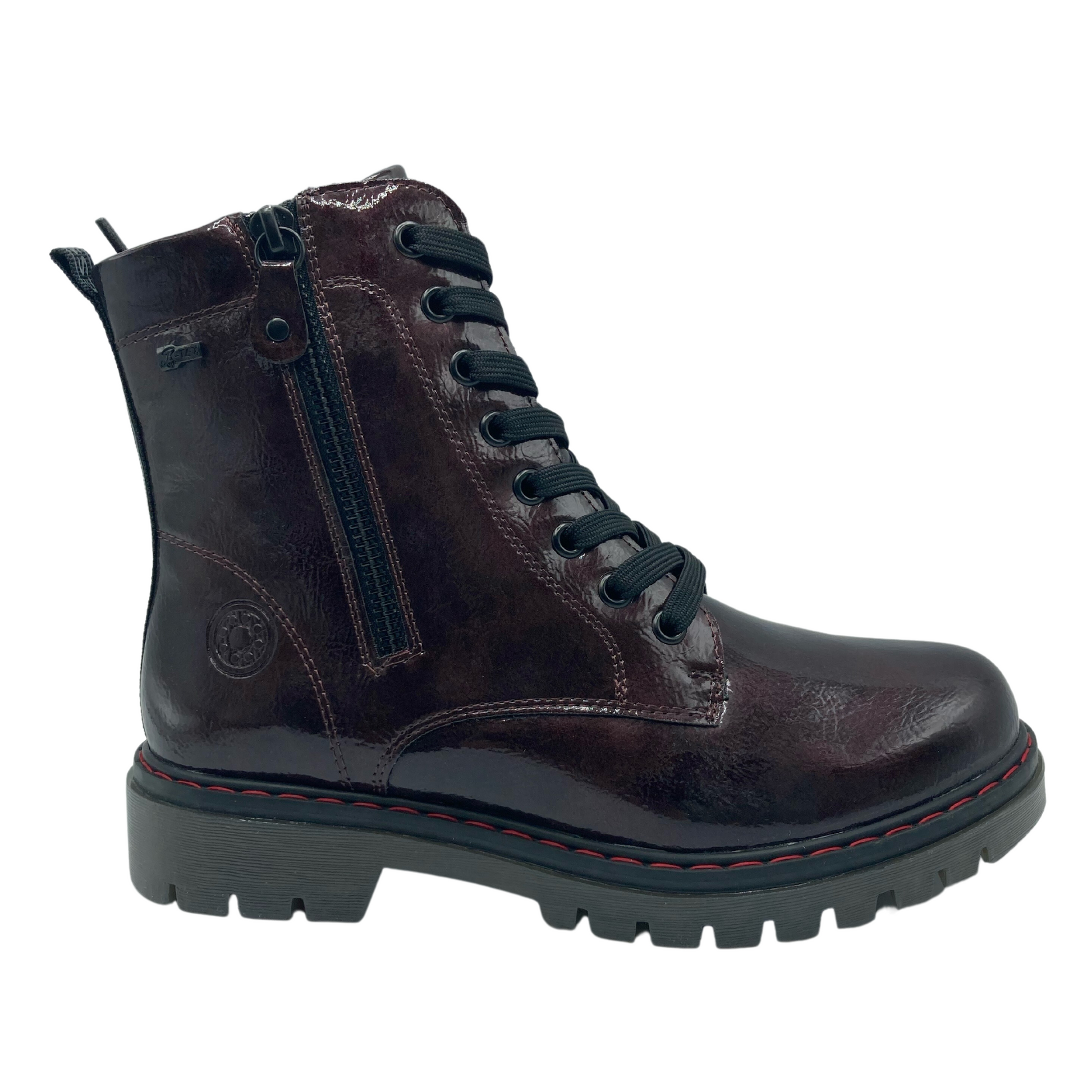 Right facing view of vegan leather boot with black laces and side zipper closure with grey and black rubber outsole