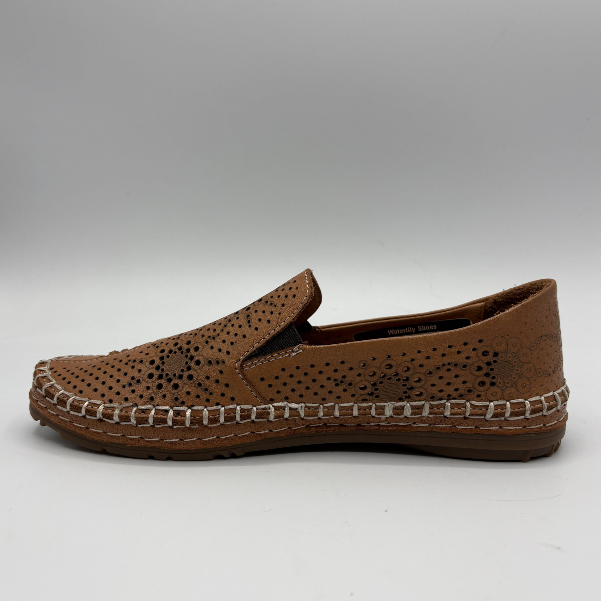 Brown loafer shoe on a white background