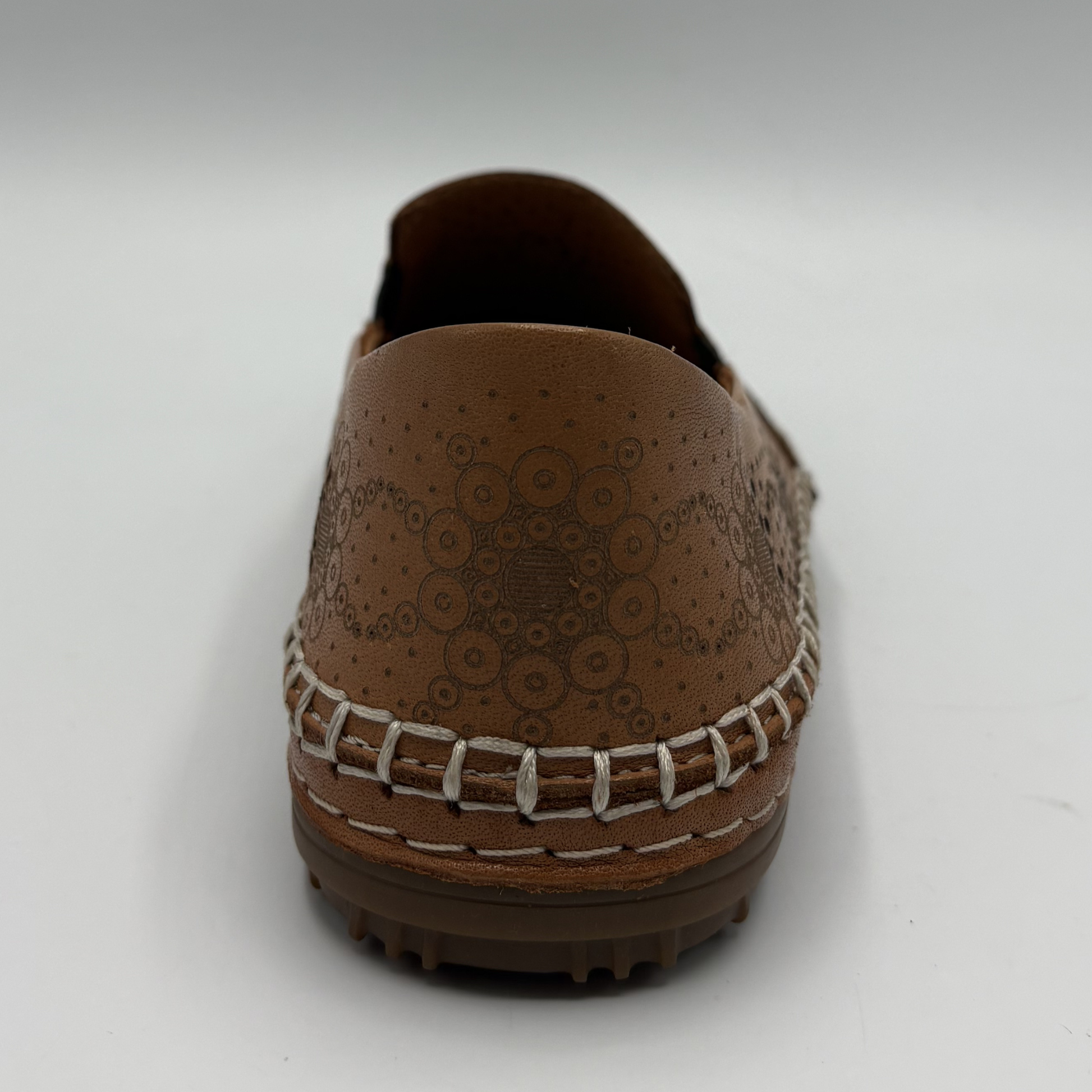 Brown loafer shoe on a white background