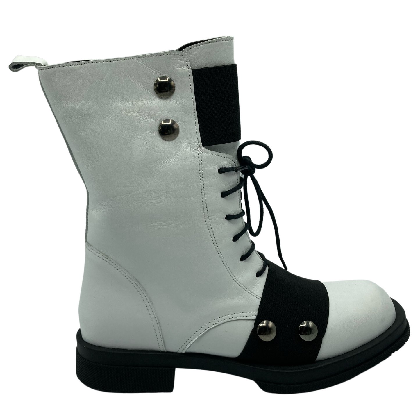 Right facing view of white leather short boot with black outsole and short block heel