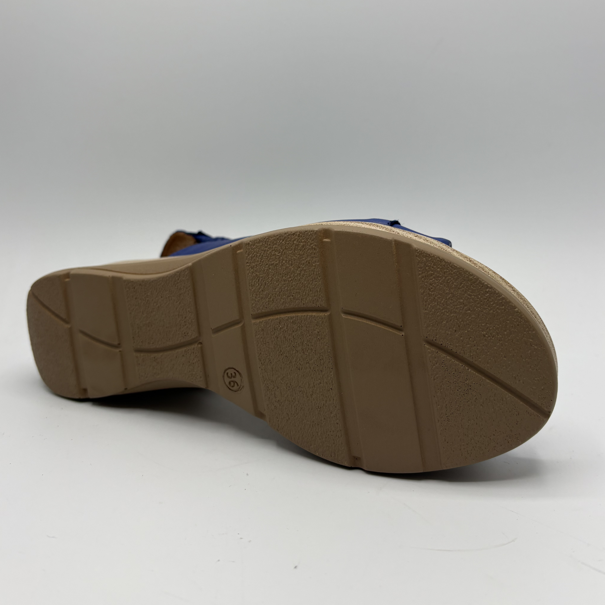Brown sole of a sandal on a white background