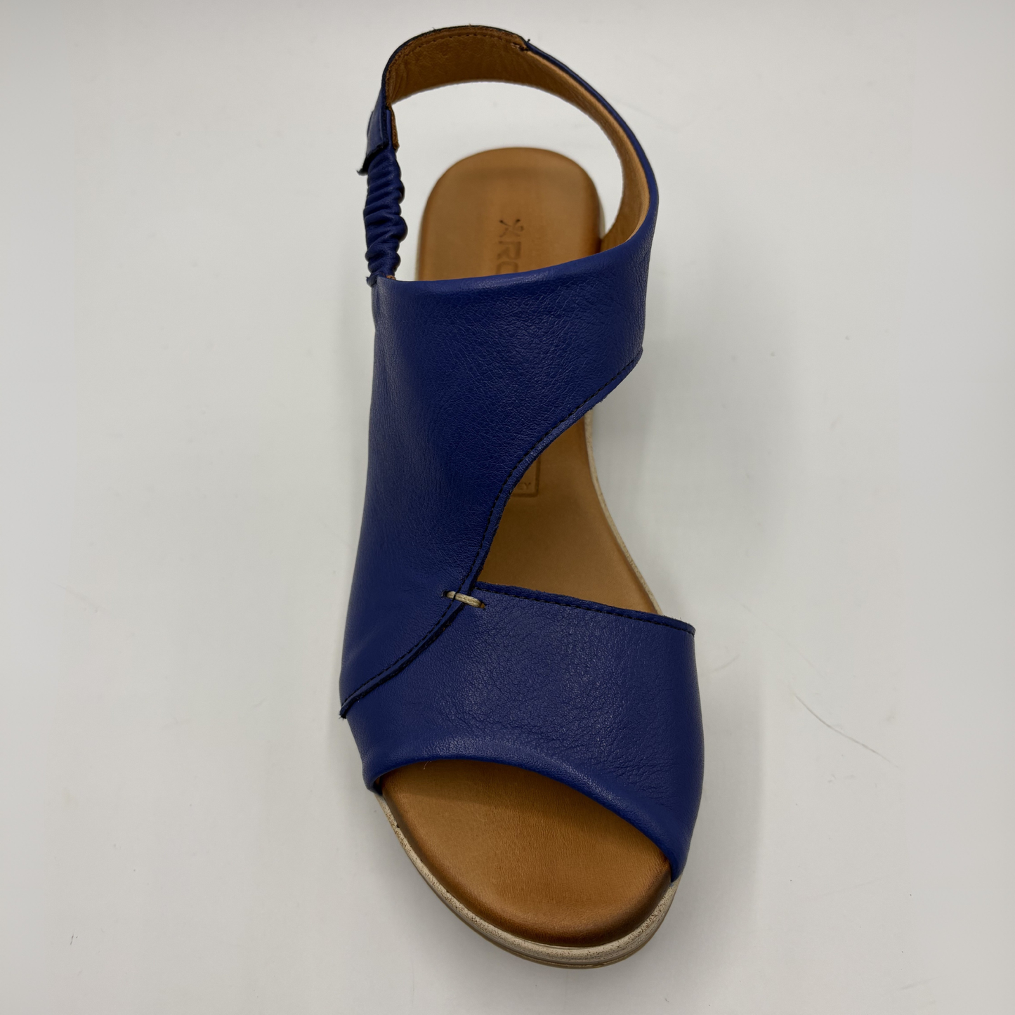 Blue sandal with a brown sole on a white background