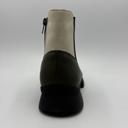 A single black leather ankle boot shown from the back on a light gray studio background, featuring a cream-colored leather back panel and a side zipper.