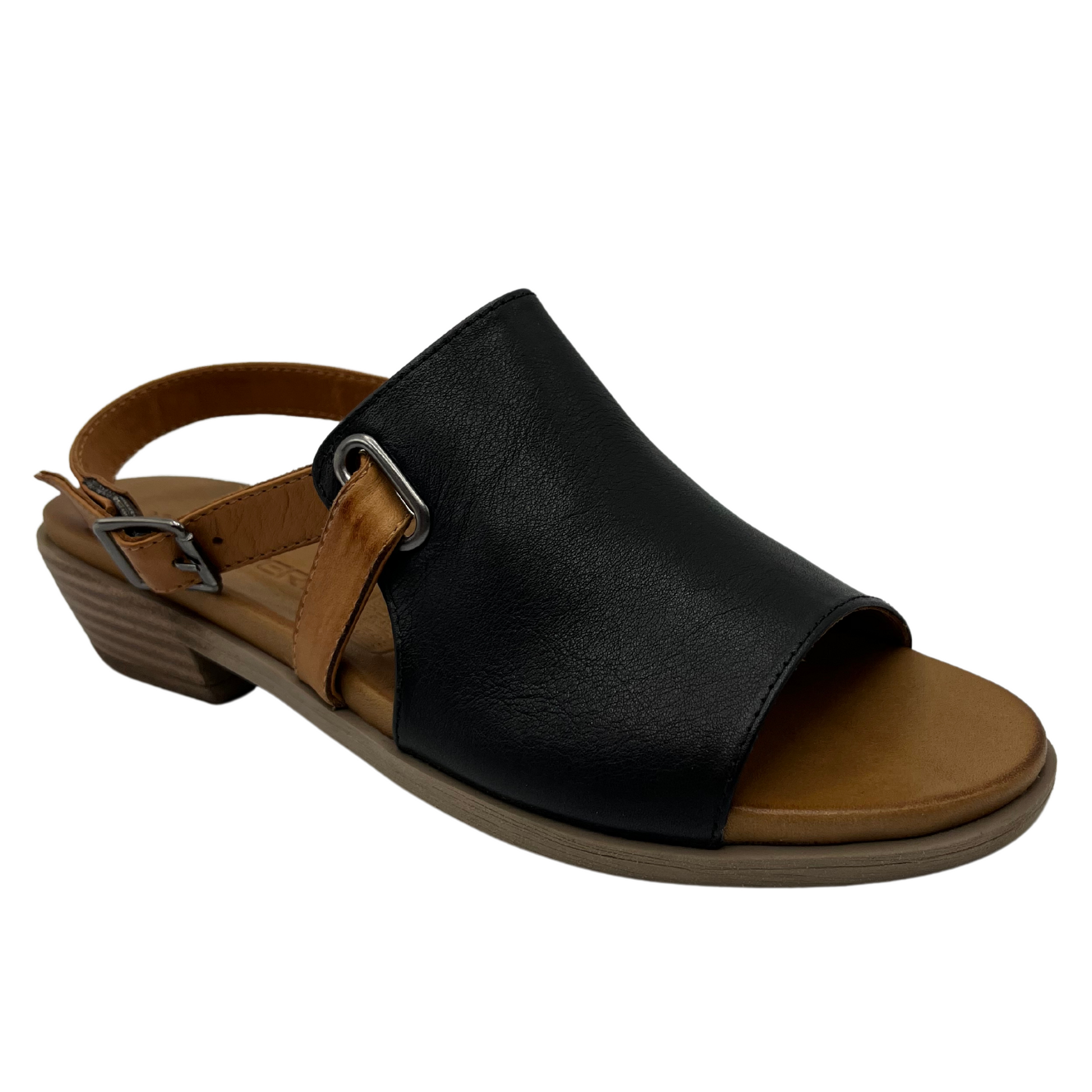 45 degree angled view of black leather sandal with low heel and brown strap