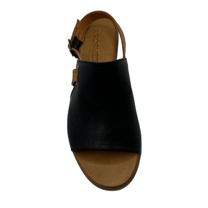 Top view of black leather sandal with open toe, brown strap and low heel