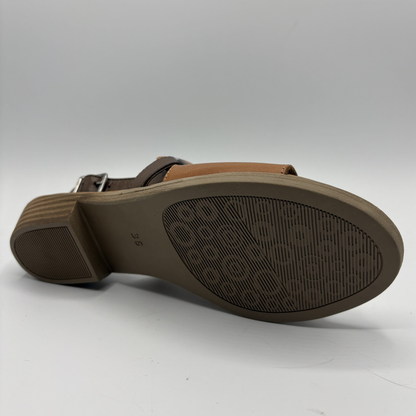 Brown sandal sole with brand logo on a white background
