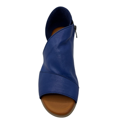 Top view of blue leather sandal with side zipper, short heel and open side design