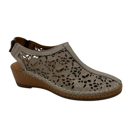 45 degree angled view of taupe leather shoe with cut out design with low wedge heel