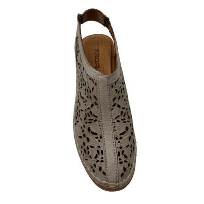 Top view of taupe leather shoe with cut out design with low wedge heel