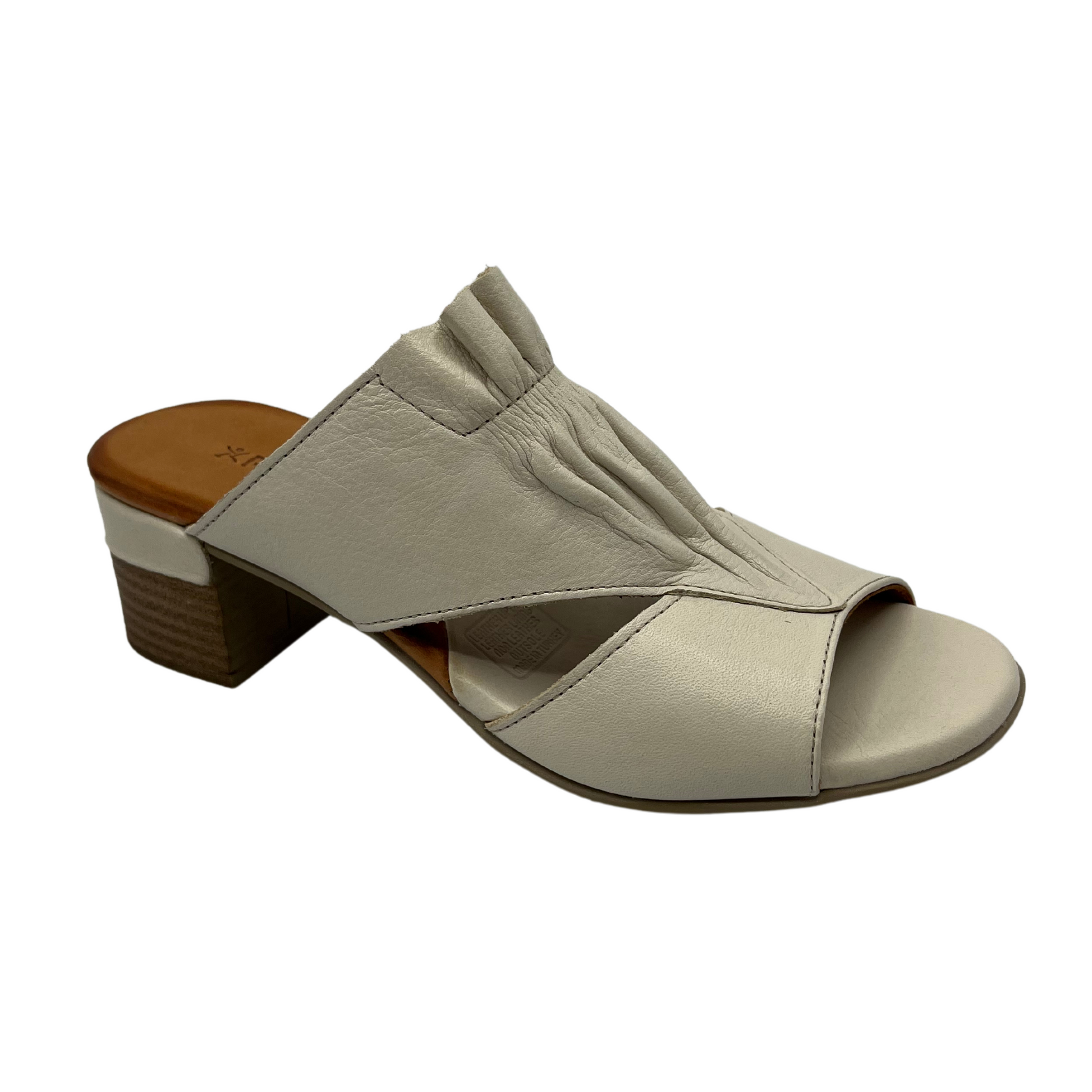 45 degree angled view of white leather sandal with block heel and peep toe