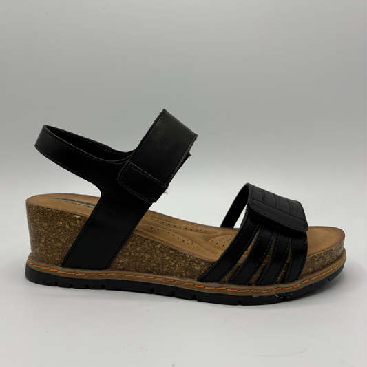 Black sandal with cork sole on a white background