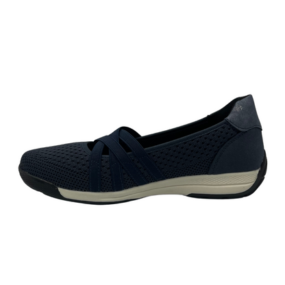 Left facing view of navy mesh flat with white and black rubber outsole