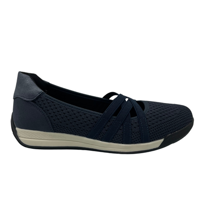 Right facing view of navy blue mesh flat with white and black rubber outsole