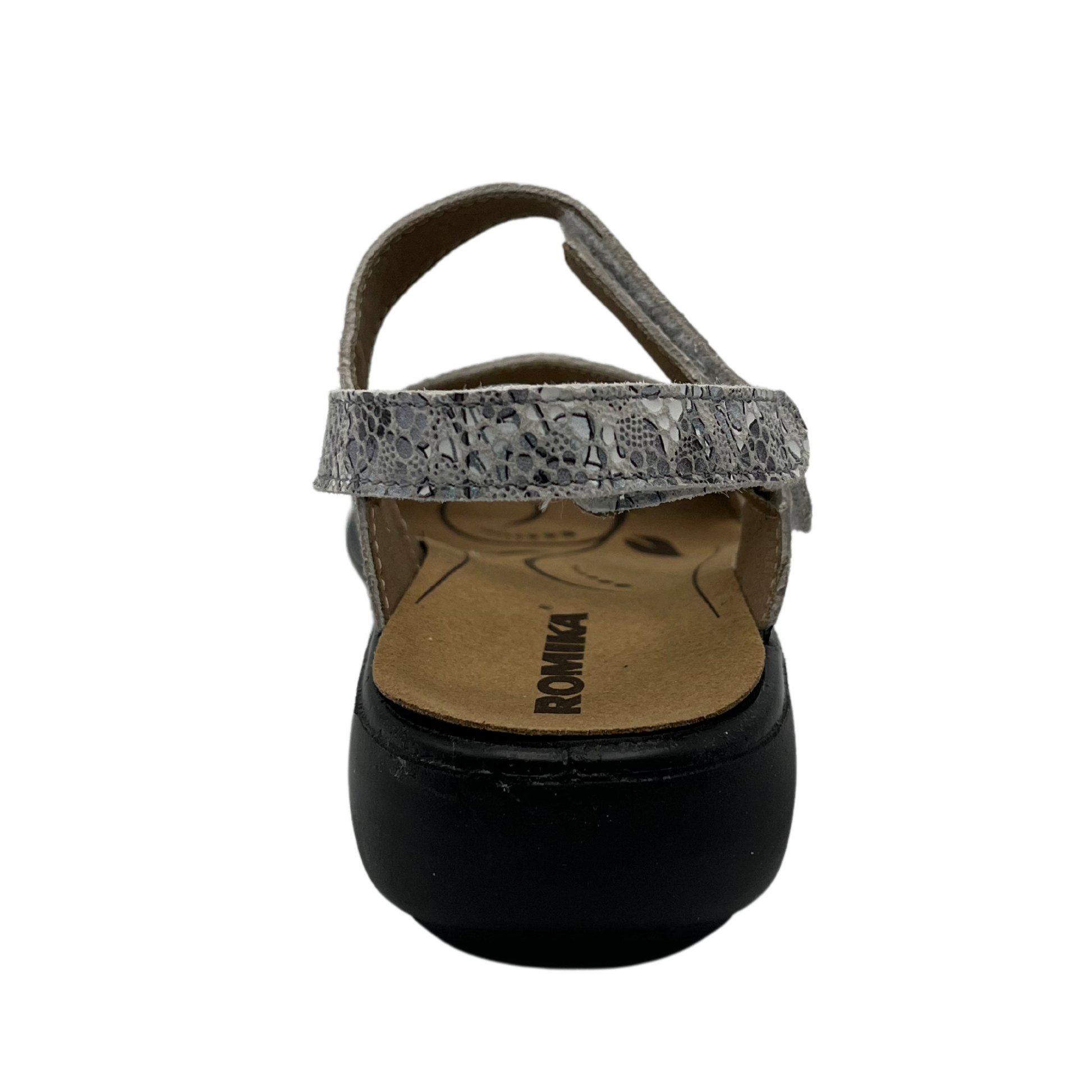 Back view of sandal with white and grey patterned straps and black rubber outsole