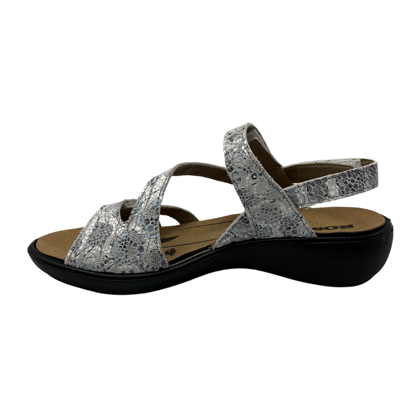 Left facing view of white and grey patterned sandal with black rubber outsole