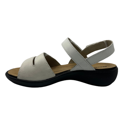 Left facing view of white leather sandal with black rubber outsole