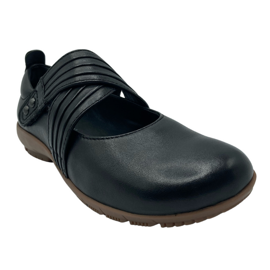 45 degree angled view of black leather, double strap mary jane shoe with brown rubber outsole