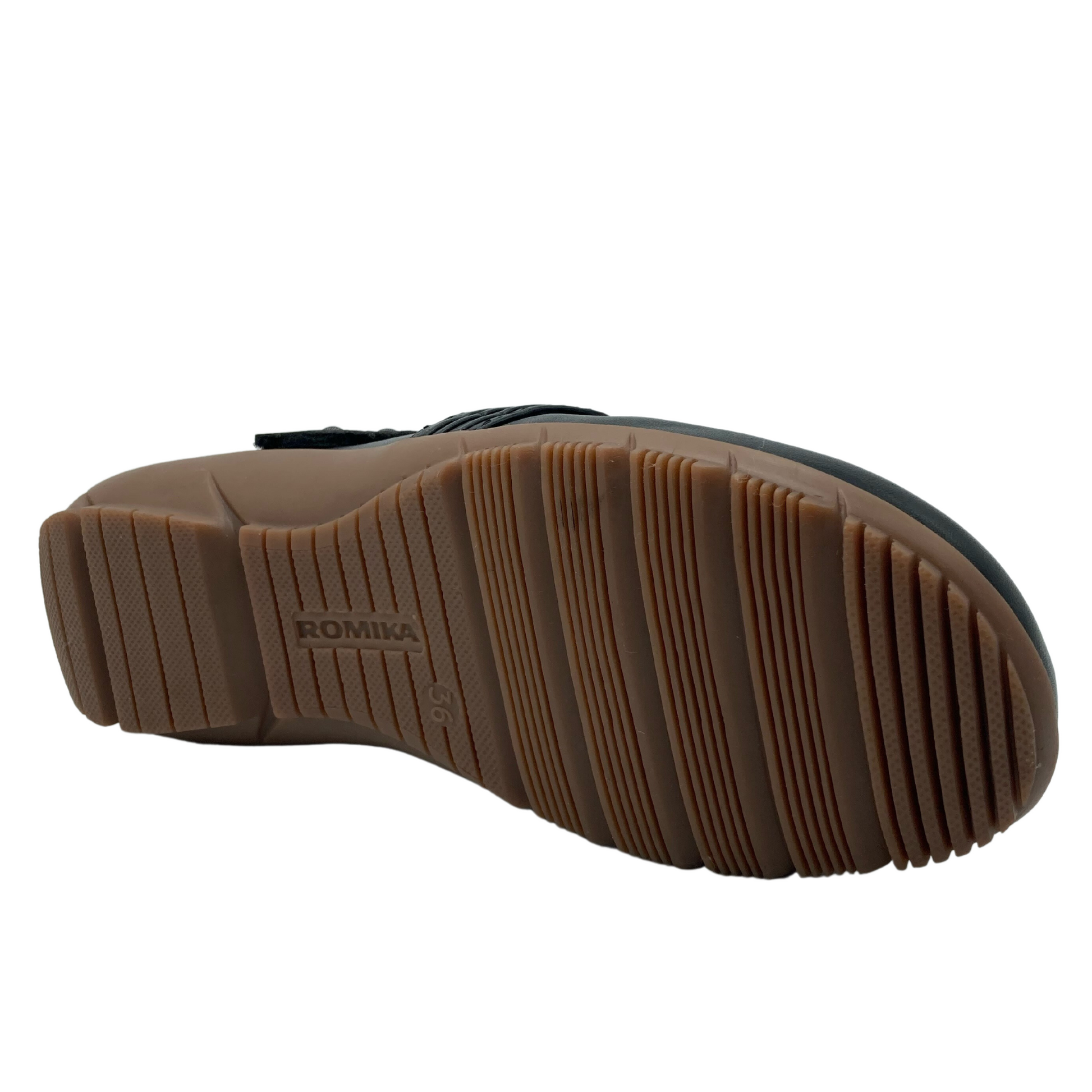 Bottom view of black leather mary jane with brown rubber outsole