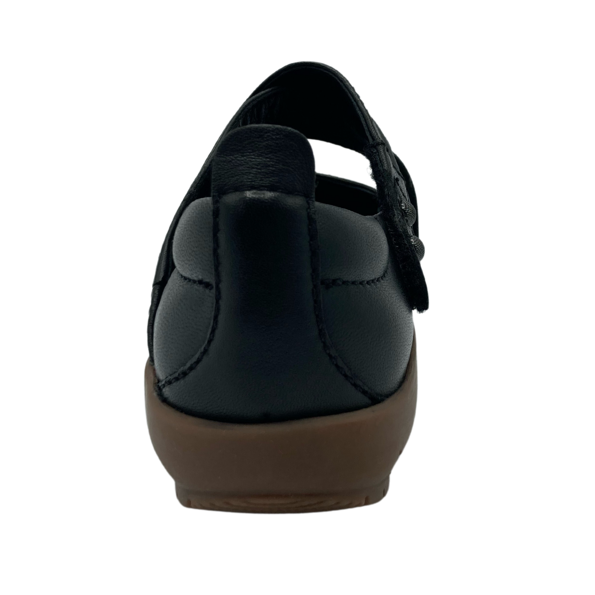 Back view of black leather mary jane shoe with brown rubber outsole
