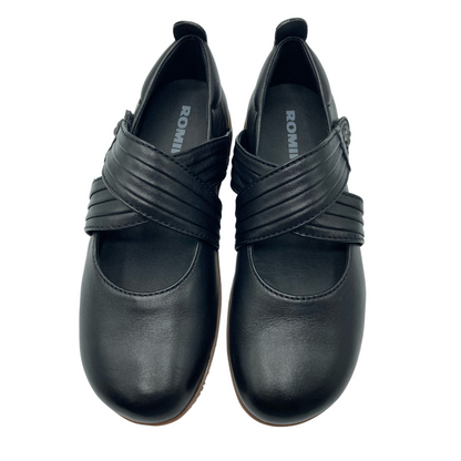 Top view of a pair of black leather mary janes with a double strap on upper