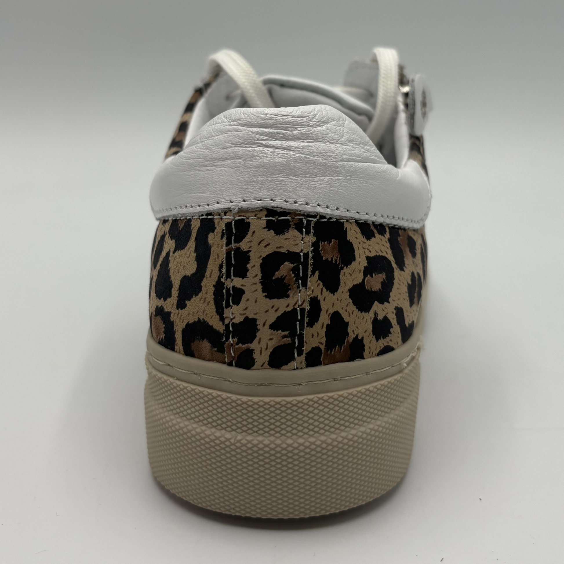 Back view of a leopard print sneaker with a beige rubber outsole