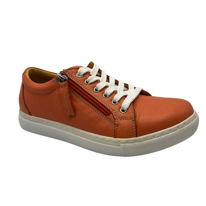 45 degree angled view of orange leather sneaker with white rubber outsole and white laces.