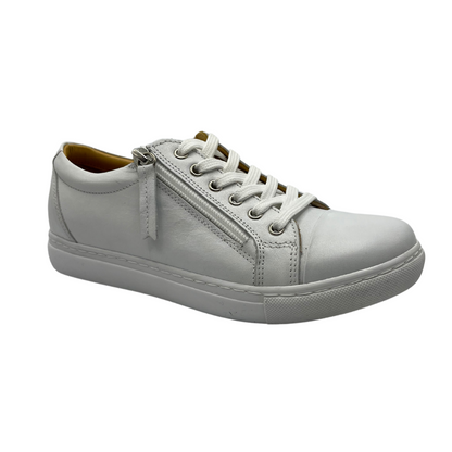 45 degree angled view of white leather sneaker with white rubber outsole and white laces.