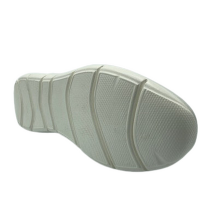 View of the bottom of the sneaker with deep grooves and white textured sole.