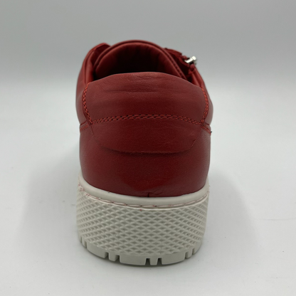 Back view of a red leather sneaker with a white rubber outsole