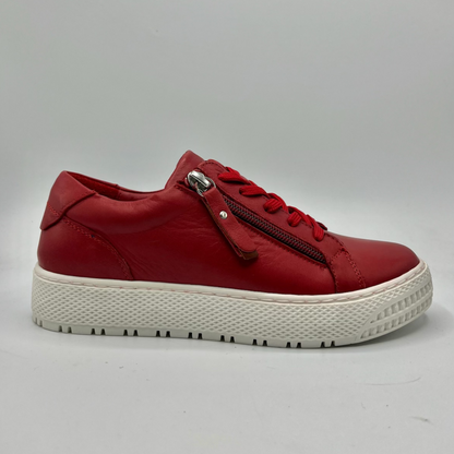 Right facing view of a red leather sneaker with a white rubber outsole