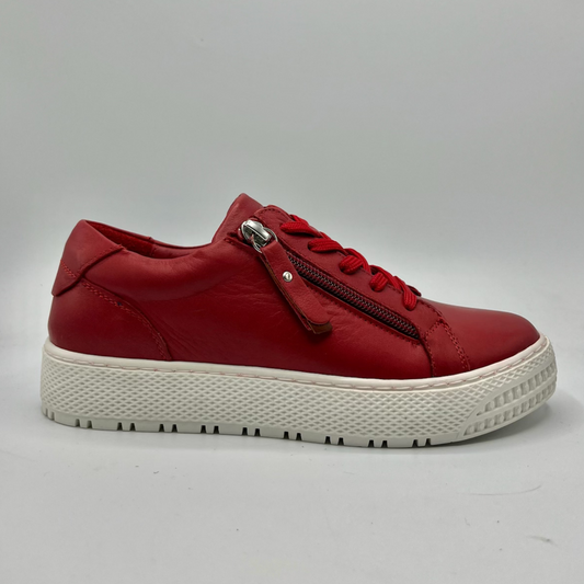 Right facing view of a red leather sneaker with a white rubber outsole