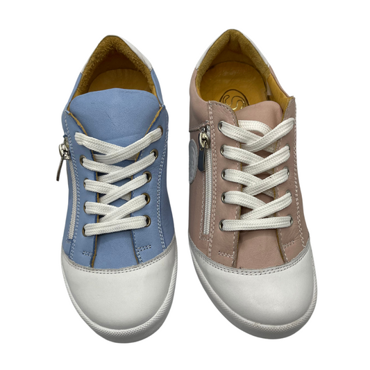 Top view of one blue sneaker beside one pink sneaker. Both have white laces, toe cap and rubber outsole. Both have tan leather lining.