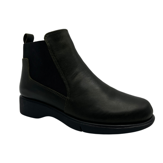 45 degree angled view of black leather short boot with elastic side gores and pull on heel tab