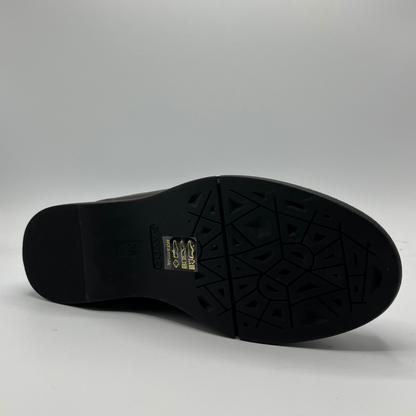 Black shoe sole on a gray background