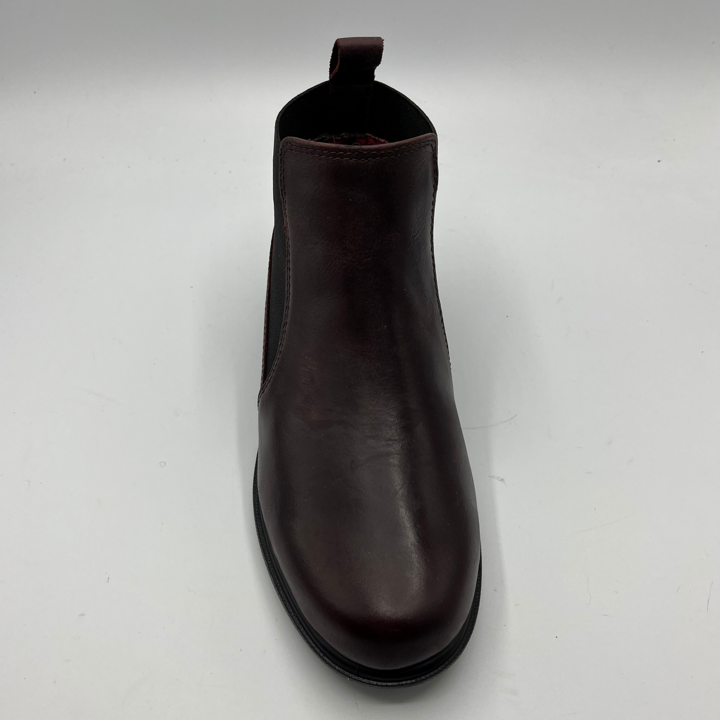 Brown leather boot on a white background