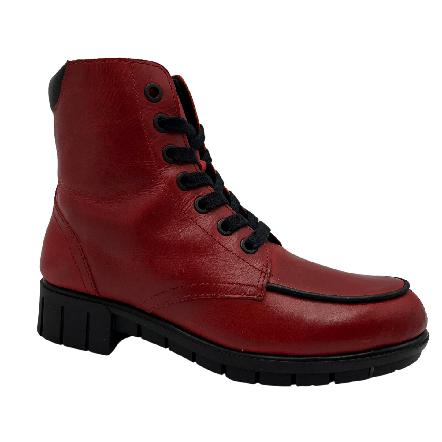 45 degree angled view of red leather short boot with black laces and short block heel on black rubber outsole