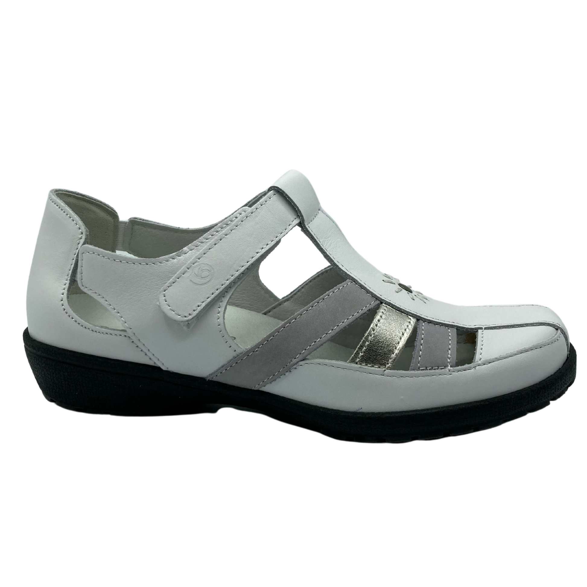 Right facing angle of white leather sandal shoe. White velcro strap and black rubber sole.