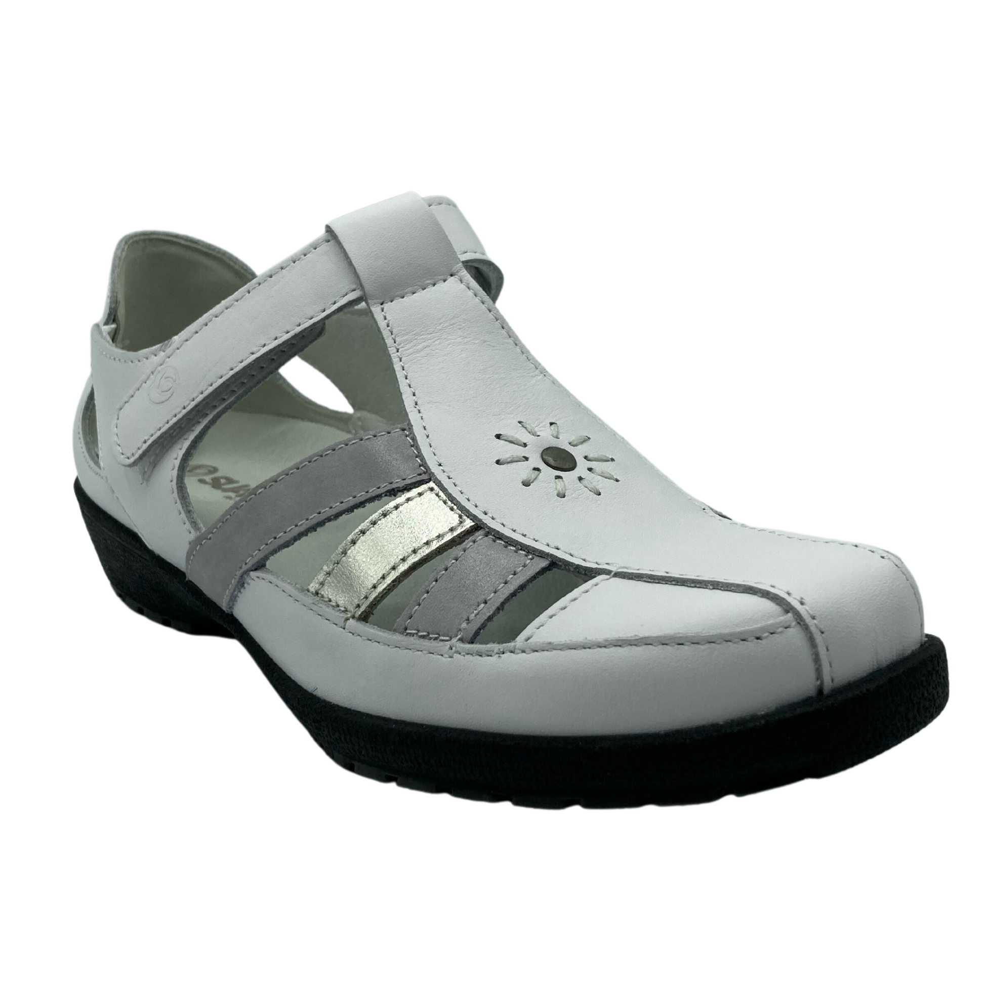 Angled view of sandal shoe with embroidered sun design on the top. White leather upper with black rubber sole.