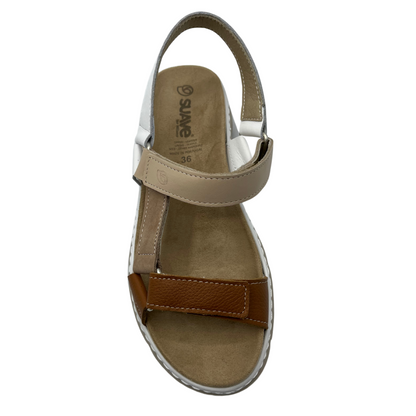 Top view of suede sandal with brown, white and tan straps
