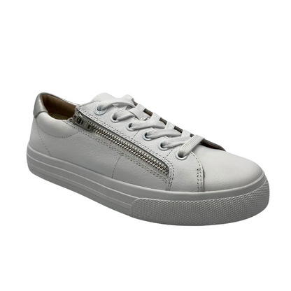45 degree angled view of white leather nubuck sneaker with side zipper closure, white rubber outsole and matching laces
