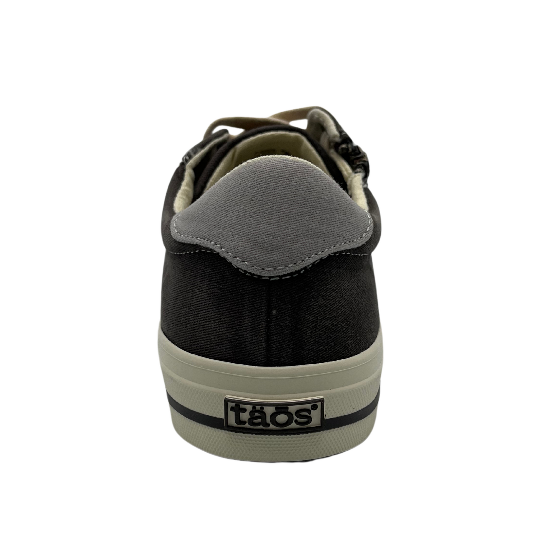 Back view of graphite canvas sneaker with white rubber outsole, side zipper closure and cream coloured laces