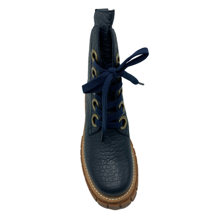 Top view of rounded toe, textured leather, navy boot with chunky rubber outsole