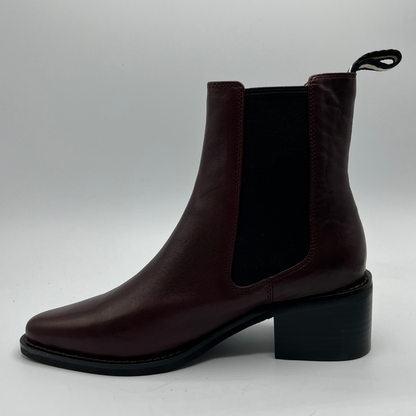 Brown ankle boot on a light gray background