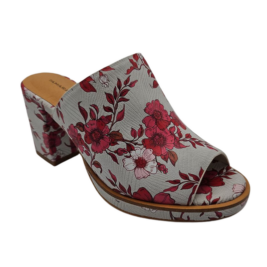 45 degree angled view of bold floral slip on sandal with wrapped block heel and cushioned footbed.