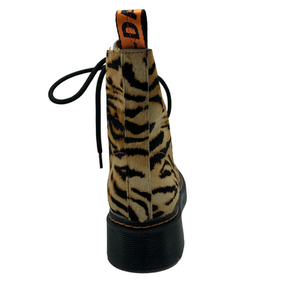 Back view of tiger print leather boot with black rubber outsole and pull on tab